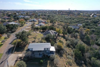 This beautiful hilltop home offers fantastic views of nearby on Apple Rock Golf Course - Horseshoe Bay in Texas - for sale on GolfHomes.com, golf home, golf lot