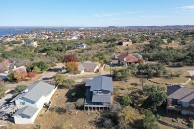 This beautiful hilltop home offers fantastic views of nearby on Apple Rock Golf Course - Horseshoe Bay in Texas - for sale on GolfHomes.com, golf home, golf lot