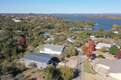 This beautiful hilltop home offers fantastic views of nearby on Apple Rock Golf Course - Horseshoe Bay in Texas - for sale on GolfHomes.com, golf home, golf lot