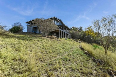This beautiful hilltop home offers fantastic views of nearby on Apple Rock Golf Course - Horseshoe Bay in Texas - for sale on GolfHomes.com, golf home, golf lot