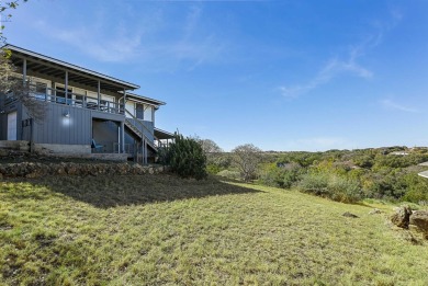 This beautiful hilltop home offers fantastic views of nearby on Apple Rock Golf Course - Horseshoe Bay in Texas - for sale on GolfHomes.com, golf home, golf lot