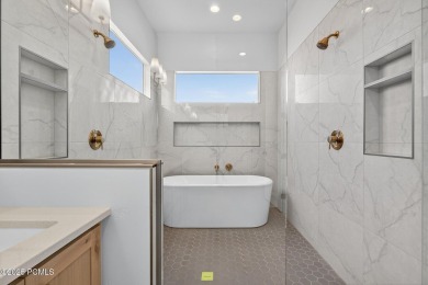 Experience breathtaking views of the city, mountains, and golf on Coral Canyon Golf Course in Utah - for sale on GolfHomes.com, golf home, golf lot