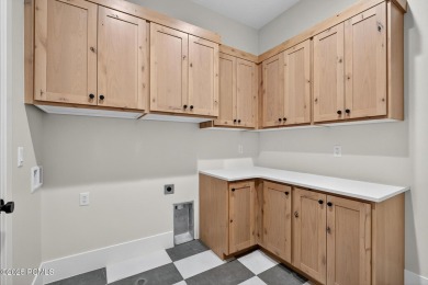 Experience breathtaking views of the city, mountains, and golf on Coral Canyon Golf Course in Utah - for sale on GolfHomes.com, golf home, golf lot