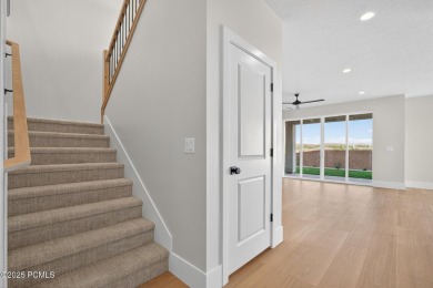 Experience breathtaking views of the city, mountains, and golf on Coral Canyon Golf Course in Utah - for sale on GolfHomes.com, golf home, golf lot