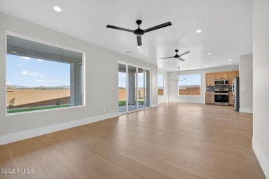 Experience breathtaking views of the city, mountains, and golf on Coral Canyon Golf Course in Utah - for sale on GolfHomes.com, golf home, golf lot
