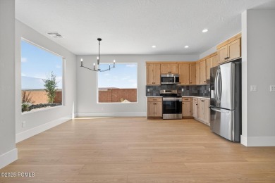 Experience breathtaking views of the city, mountains, and golf on Coral Canyon Golf Course in Utah - for sale on GolfHomes.com, golf home, golf lot