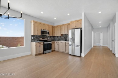 Experience breathtaking views of the city, mountains, and golf on Coral Canyon Golf Course in Utah - for sale on GolfHomes.com, golf home, golf lot