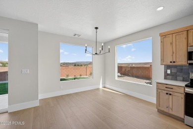 Experience breathtaking views of the city, mountains, and golf on Coral Canyon Golf Course in Utah - for sale on GolfHomes.com, golf home, golf lot