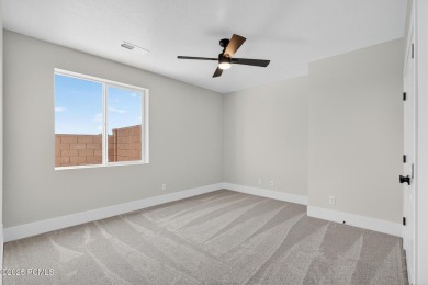 Experience breathtaking views of the city, mountains, and golf on Coral Canyon Golf Course in Utah - for sale on GolfHomes.com, golf home, golf lot