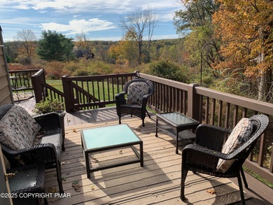 Mountain and golf course views make this light filled open floor on Buck Hill Golf Club  in Pennsylvania - for sale on GolfHomes.com, golf home, golf lot