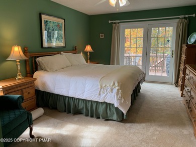 Mountain and golf course views make this light filled open floor on Buck Hill Golf Club  in Pennsylvania - for sale on GolfHomes.com, golf home, golf lot