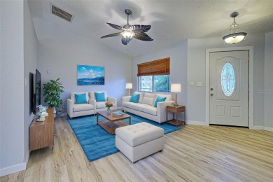 Welcome to this beautifully updated home featuring 3 bedrooms on Jacaranda West Country Club in Florida - for sale on GolfHomes.com, golf home, golf lot