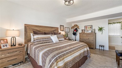 Beautifully updated waterfront condominium with stunning lake on Seasons Ridge At Four Seasons in Missouri - for sale on GolfHomes.com, golf home, golf lot