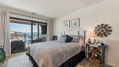 Beautifully updated waterfront condominium with stunning lake on Seasons Ridge At Four Seasons in Missouri - for sale on GolfHomes.com, golf home, golf lot