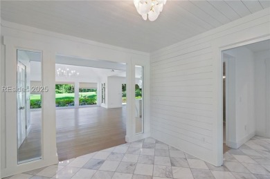 Coastal elegance meets breathtaking golf views in this stunning on Dolphin Head Golf Club in South Carolina - for sale on GolfHomes.com, golf home, golf lot