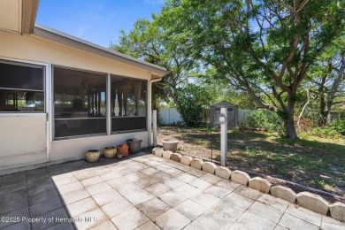 Welcome to this beautifully maintained 3-bedroom, 2-bath home on Oak Hills Country Club in Florida - for sale on GolfHomes.com, golf home, golf lot