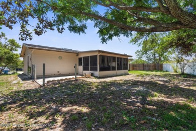 Welcome to this beautifully maintained 3-bedroom, 2-bath home on Oak Hills Country Club in Florida - for sale on GolfHomes.com, golf home, golf lot