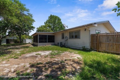 Welcome to this beautifully maintained 3-bedroom, 2-bath home on Oak Hills Country Club in Florida - for sale on GolfHomes.com, golf home, golf lot