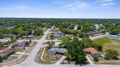 Welcome to this beautifully maintained 3-bedroom, 2-bath home on Oak Hills Country Club in Florida - for sale on GolfHomes.com, golf home, golf lot