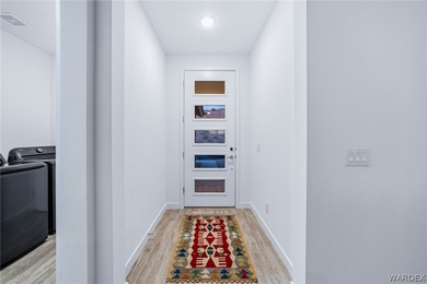 Experience elevated desert luxury in the prestigious Laughlin on Laughlin Ranch Golf Club in Arizona - for sale on GolfHomes.com, golf home, golf lot