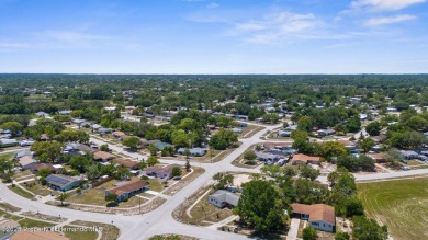 Welcome to this beautifully maintained 3-bedroom, 2-bath home on Oak Hills Country Club in Florida - for sale on GolfHomes.com, golf home, golf lot