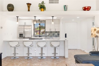 Welcome to 77247 Olympic Way, an exceptional lakefront retreat on Palm Desert Resort Country Club in California - for sale on GolfHomes.com, golf home, golf lot