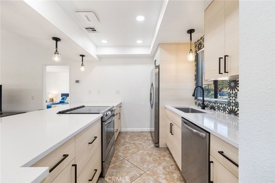 Welcome to 77247 Olympic Way, an exceptional lakefront retreat on Palm Desert Resort Country Club in California - for sale on GolfHomes.com, golf home, golf lot