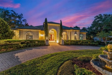 Nestled within the gates of the renowned Isleworth Golf  Country on Isleworth Golf and Country Club in Florida - for sale on GolfHomes.com, golf home, golf lot