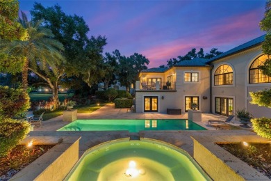 Nestled within the gates of the renowned Isleworth Golf  Country on Isleworth Golf and Country Club in Florida - for sale on GolfHomes.com, golf home, golf lot