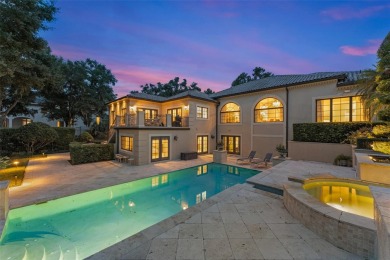 Nestled within the gates of the renowned Isleworth Golf  Country on Isleworth Golf and Country Club in Florida - for sale on GolfHomes.com, golf home, golf lot