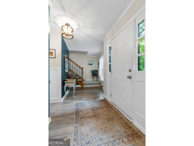 Updated 4-bedroom, 2 and a half bathroom home situated on on Braelinn Golf Club in Georgia - for sale on GolfHomes.com, golf home, golf lot