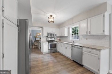 Updated 4-bedroom, 2 and a half bathroom home situated on on Braelinn Golf Club in Georgia - for sale on GolfHomes.com, golf home, golf lot