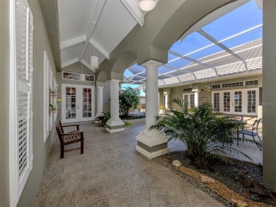 Timeless and traditional custom built Arthur Rutenberg courtyard on Plantation Golf and Country Club in Florida - for sale on GolfHomes.com, golf home, golf lot