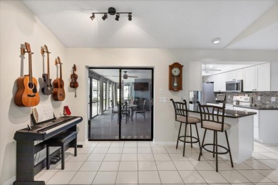 This beautifully maintained 3-bedroom, 2-bathroom pool home on Rotonda Golf and Country Club The Palms Course in Florida - for sale on GolfHomes.com, golf home, golf lot