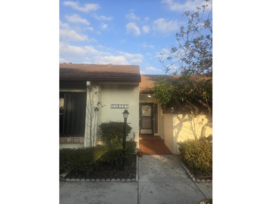 Move-in ready in a desirable 55+ community! Conveniently located on Palm Beach National Golf and Country Club in Florida - for sale on GolfHomes.com, golf home, golf lot