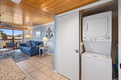 Discover this elegantly appointed second-floor, 2-bedroom on Sandpiper Cove Golf Course in Florida - for sale on GolfHomes.com, golf home, golf lot