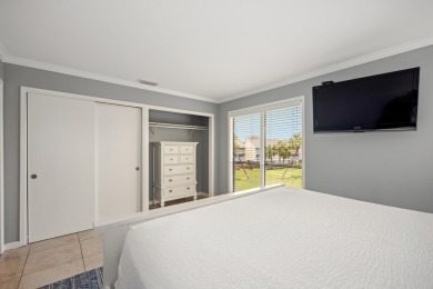 Discover this elegantly appointed second-floor, 2-bedroom on Sandpiper Cove Golf Course in Florida - for sale on GolfHomes.com, golf home, golf lot