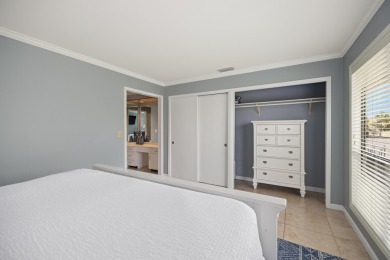 Discover this elegantly appointed second-floor, 2-bedroom on Sandpiper Cove Golf Course in Florida - for sale on GolfHomes.com, golf home, golf lot