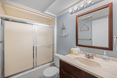 Discover this elegantly appointed second-floor, 2-bedroom on Sandpiper Cove Golf Course in Florida - for sale on GolfHomes.com, golf home, golf lot
