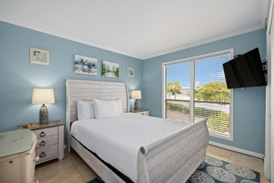Discover this elegantly appointed second-floor, 2-bedroom on Sandpiper Cove Golf Course in Florida - for sale on GolfHomes.com, golf home, golf lot