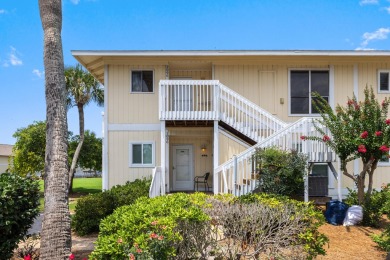 Discover this elegantly appointed second-floor, 2-bedroom on Sandpiper Cove Golf Course in Florida - for sale on GolfHomes.com, golf home, golf lot