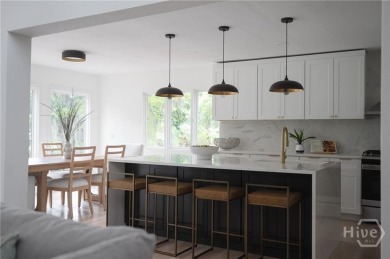 Flooded with natural light, this stunning Scandinavian-inspired on The Landings Club - Plantation in Georgia - for sale on GolfHomes.com, golf home, golf lot