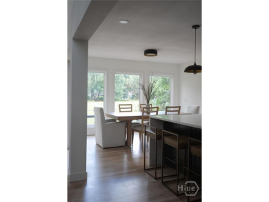 Flooded with natural light, this stunning Scandinavian-inspired on The Landings Club - Plantation in Georgia - for sale on GolfHomes.com, golf home, golf lot