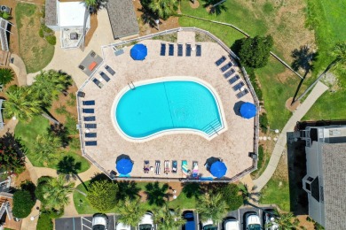 Discover this elegantly appointed second-floor, 2-bedroom on Sandpiper Cove Golf Course in Florida - for sale on GolfHomes.com, golf home, golf lot