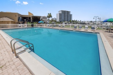 Discover this elegantly appointed second-floor, 2-bedroom on Sandpiper Cove Golf Course in Florida - for sale on GolfHomes.com, golf home, golf lot