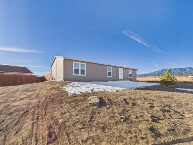 This well-maintained 3-bedroom, 2-bathroom manufactured home on Hollydot Golf Course in Colorado - for sale on GolfHomes.com, golf home, golf lot