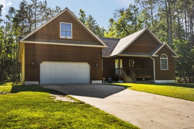 This beautifully designed home offers the perfect blend of on Michaywe Pines Course in Michigan - for sale on GolfHomes.com, golf home, golf lot
