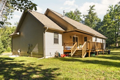 This beautifully designed home offers the perfect blend of on Michaywe Pines Course in Michigan - for sale on GolfHomes.com, golf home, golf lot