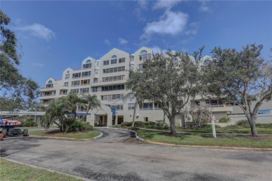 Perched on the top floor of Crystal Bay, this fourth-story condo on Feather Sound Country Club in Florida - for sale on GolfHomes.com, golf home, golf lot