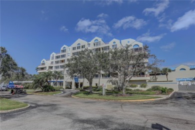 Perched on the top floor of Crystal Bay, this fourth-story condo on Feather Sound Country Club in Florida - for sale on GolfHomes.com, golf home, golf lot